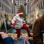 Holiday Madness In Midtown Manhattan   The New York Times With Kiss Under This Christmas Decoration Crossword Clue