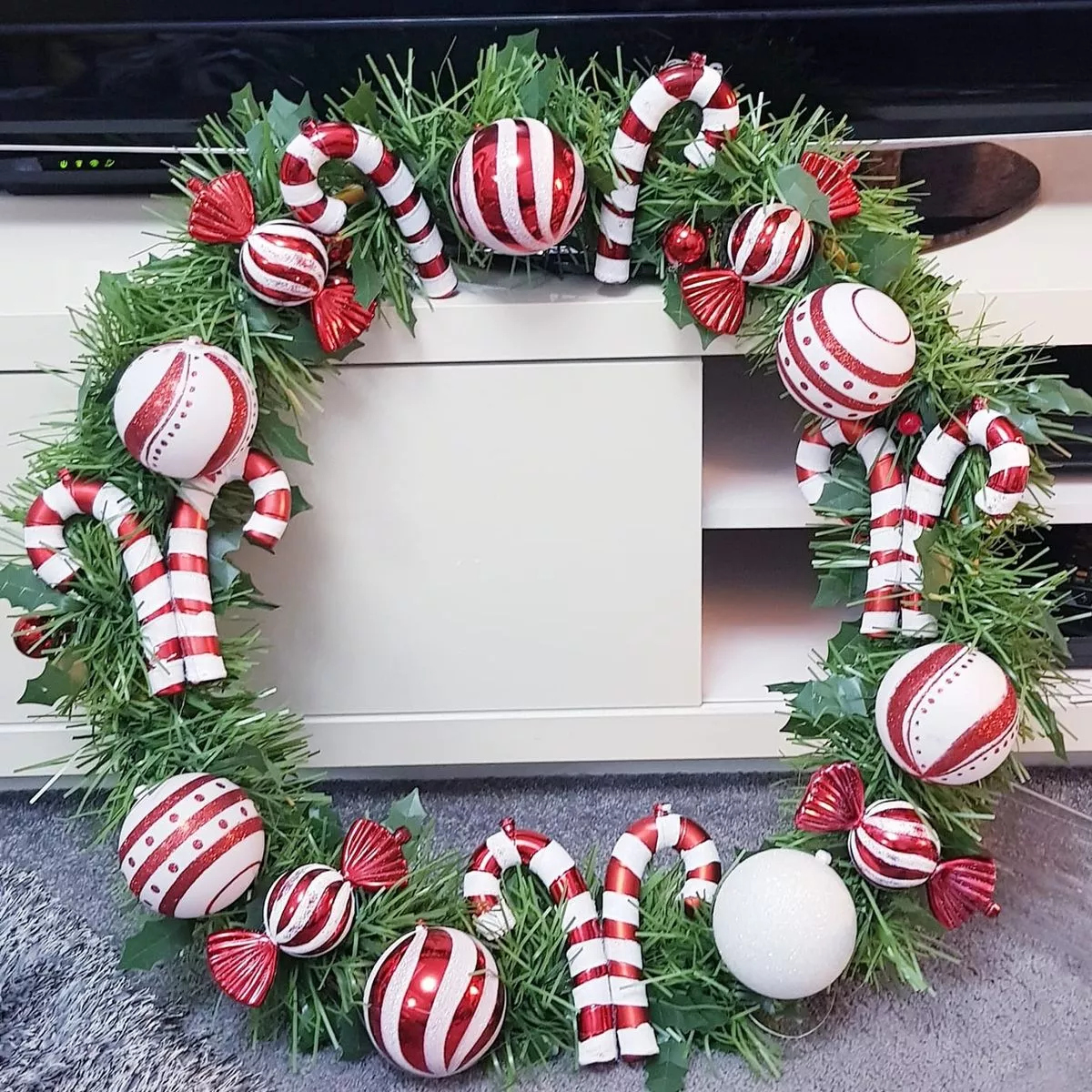 woman crafts candy cane christmas wreath using 30p hoop wowing within christmas wreath material daily crossword Woman Crafts Candy Cane Christmas Wreath Using 30P Hoop - Wowing within Christmas Wreath Material Daily Crossword